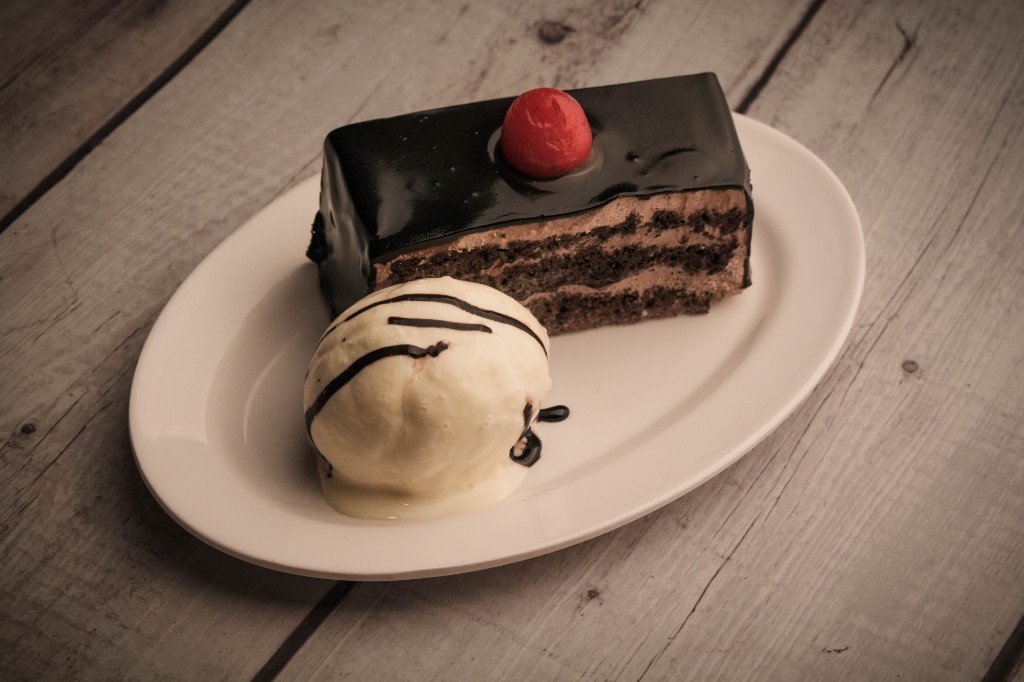 Chocolate truffle cake with a scoop of ice cream